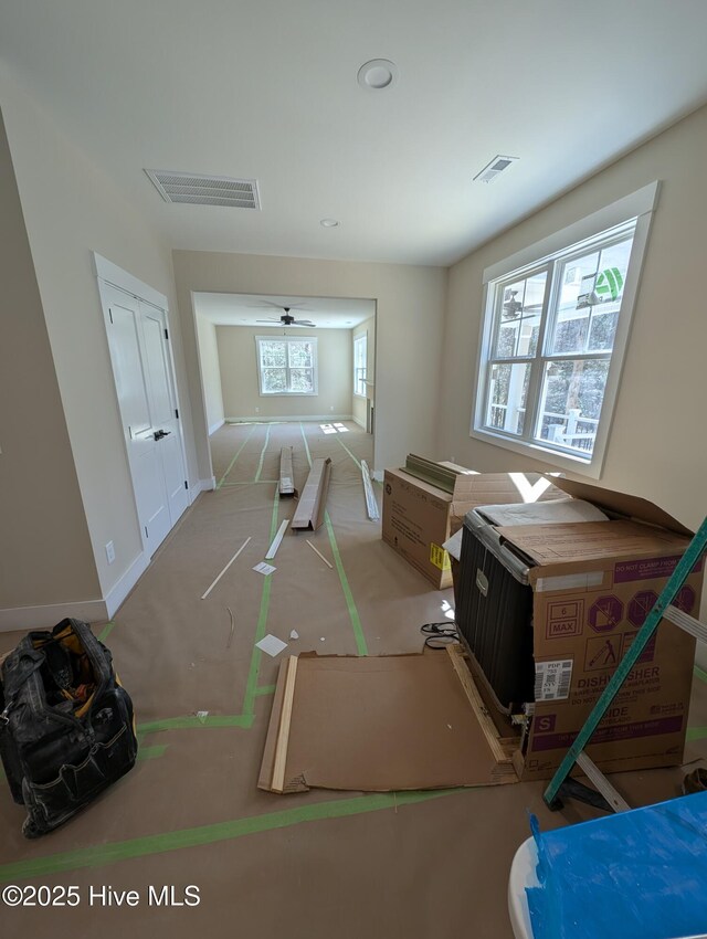 unfurnished living room with beamed ceiling and coffered ceiling