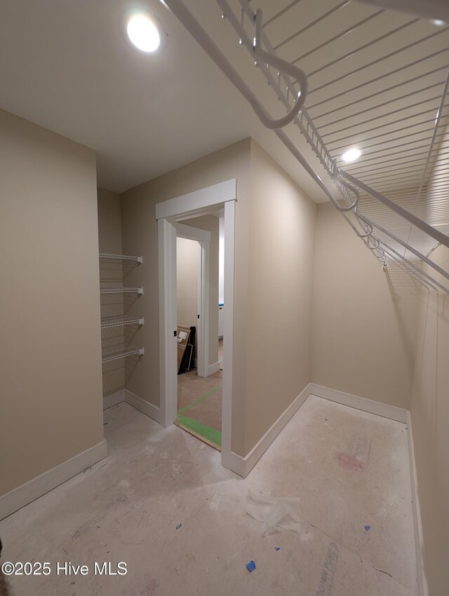 clothes washing area with cabinets and hookup for a washing machine