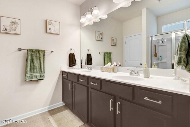 bathroom featuring vanity and an enclosed shower