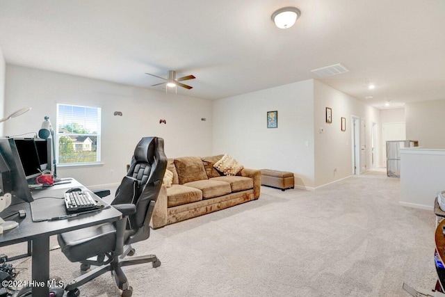 office featuring light carpet and ceiling fan