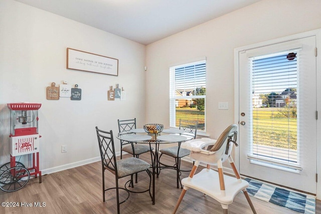 dining space with light wood-type flooring