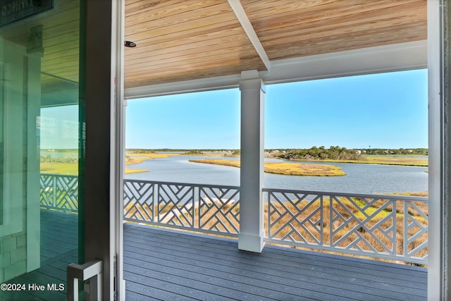 wooden terrace with a water view