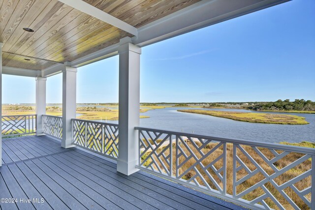 wooden terrace with a water view