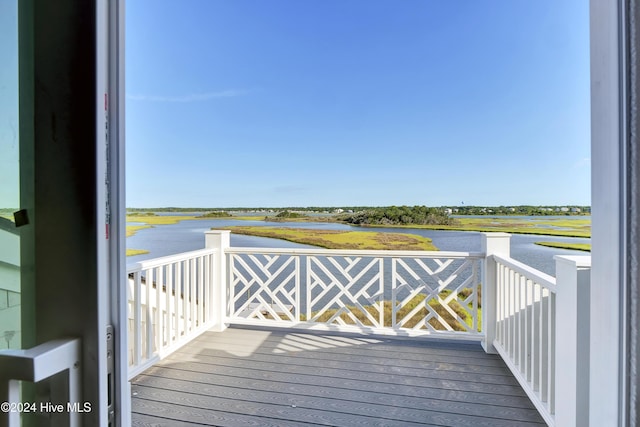 wooden deck with a water view