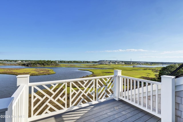 wooden deck with a water view