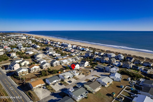 aerial view featuring a water view, a residential view, and a view of the beach