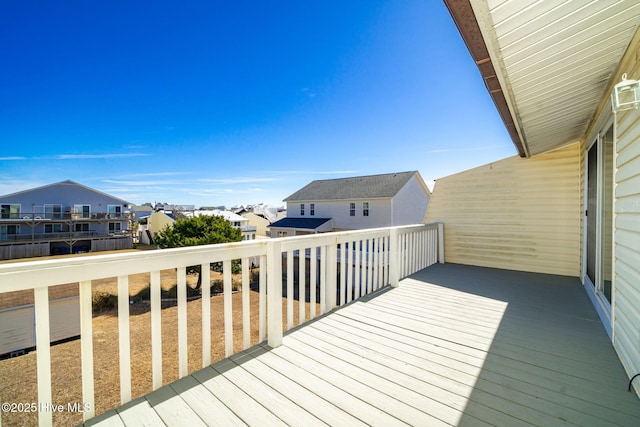 wooden deck featuring a residential view