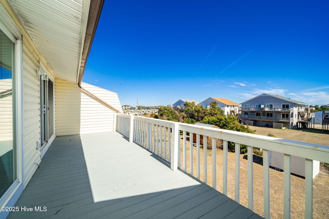 wooden deck featuring a residential view