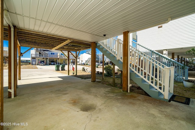 view of patio / terrace with a carport and stairway