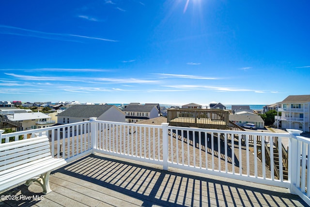 wooden deck featuring a residential view