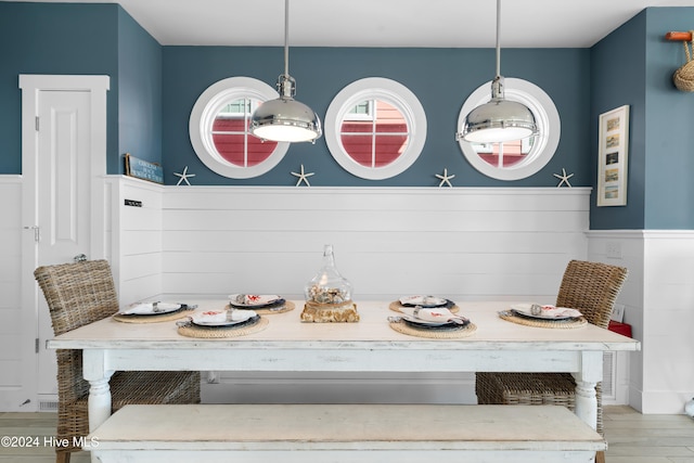 dining space with hardwood / wood-style flooring