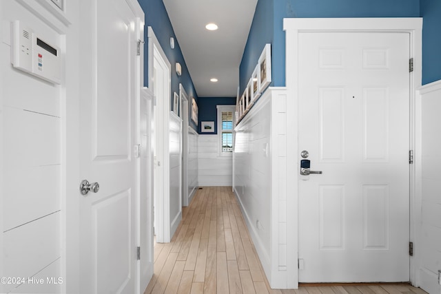 hall with light wood-type flooring