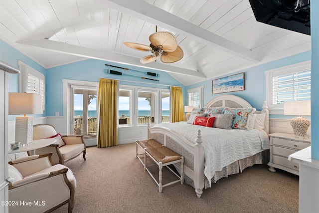 bedroom with lofted ceiling with beams, ceiling fan, a water view, and light colored carpet