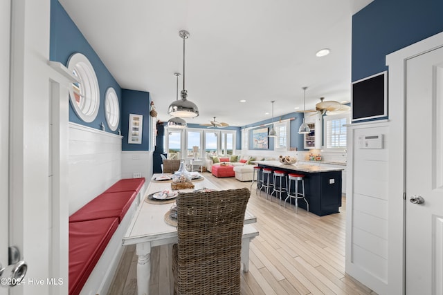 dining area featuring light wood-type flooring