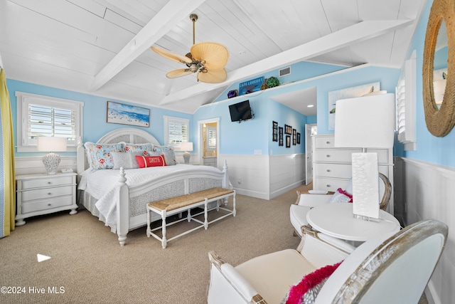 carpeted bedroom featuring vaulted ceiling with beams, ceiling fan, and wooden ceiling