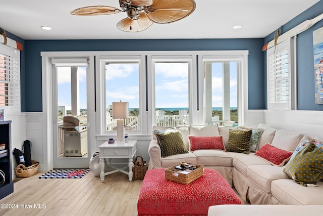 living room with hardwood / wood-style floors and ceiling fan