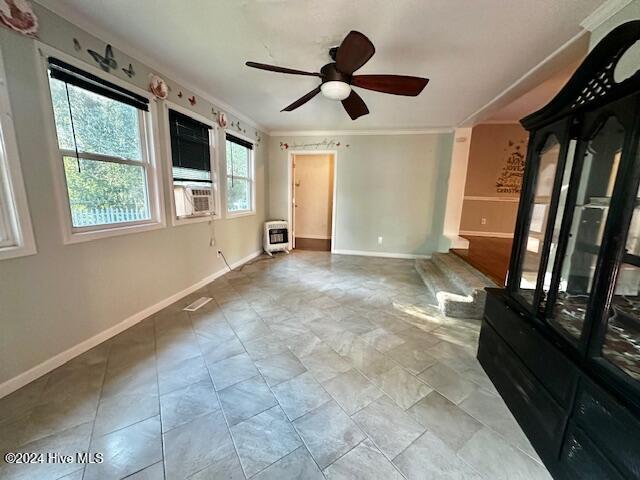 unfurnished living room featuring cooling unit, heating unit, ceiling fan, and crown molding