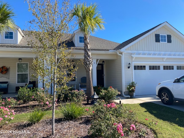 view of front of house with a porch and a garage