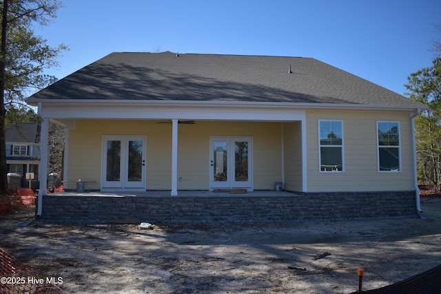 rear view of house featuring ceiling fan, french doors, and a patio