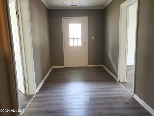 entryway with crown molding and dark hardwood / wood-style floors