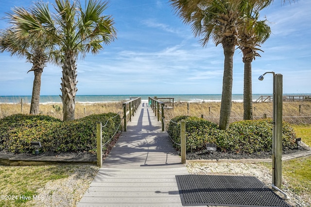 view of property's community with a view of the beach and a water view