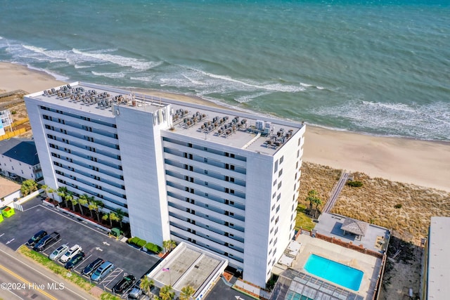 bird's eye view with a water view and a view of the beach