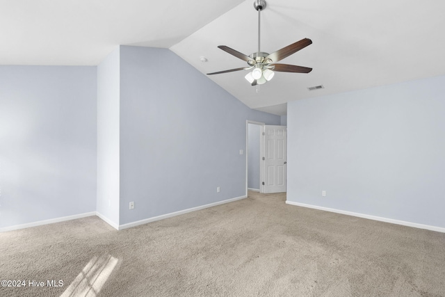 spare room with light carpet, ceiling fan, and lofted ceiling