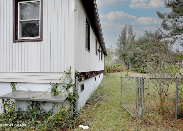 view of home's exterior featuring a yard