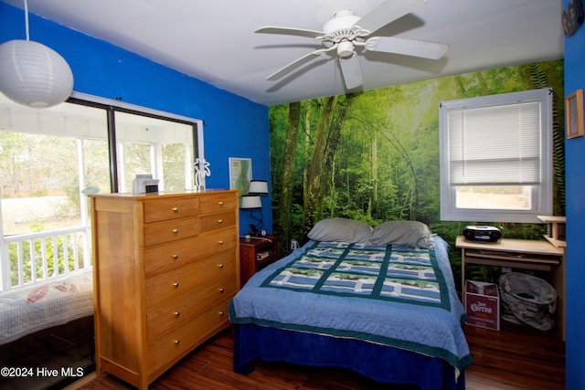 bedroom featuring dark hardwood / wood-style flooring and ceiling fan