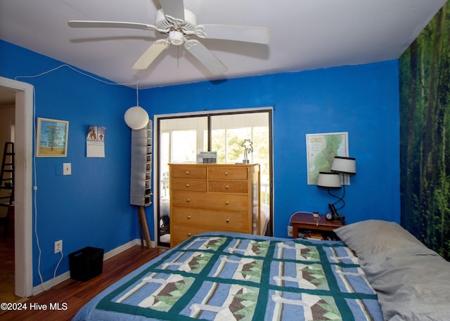 bedroom featuring ceiling fan and dark wood-type flooring