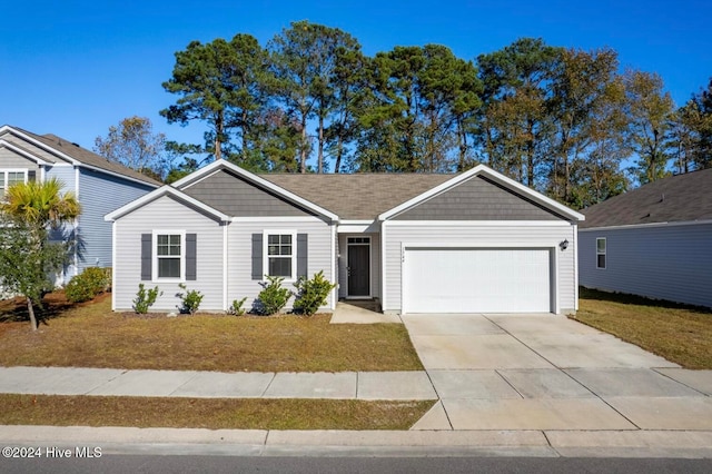 ranch-style house with a front lawn and a garage