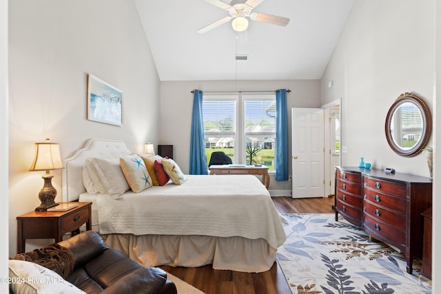 bedroom featuring ceiling fan, high vaulted ceiling, and light hardwood / wood-style flooring