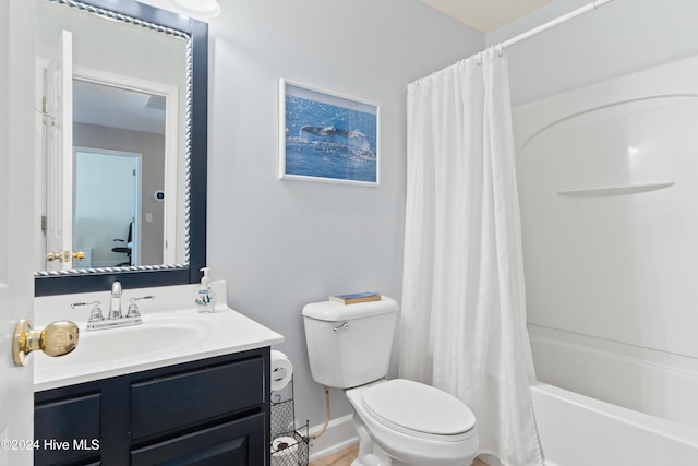 full bathroom featuring vanity, toilet, and shower / bath combo with shower curtain