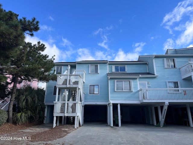 raised beach house with a carport