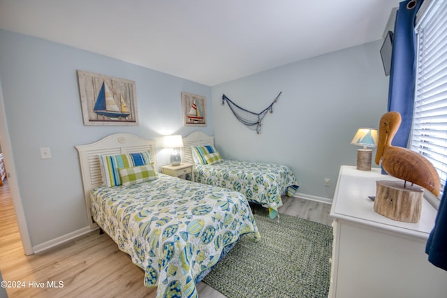 bedroom featuring wood-type flooring