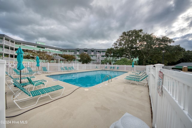 view of pool featuring a patio area