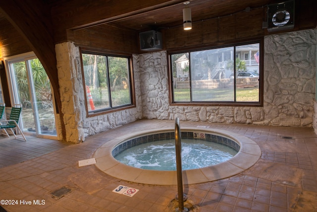 view of pool with an indoor in ground hot tub