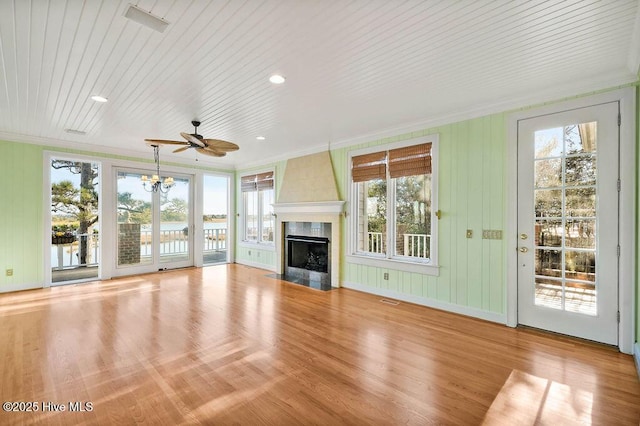 unfurnished living room with a fireplace, light hardwood / wood-style flooring, ceiling fan, and ornamental molding