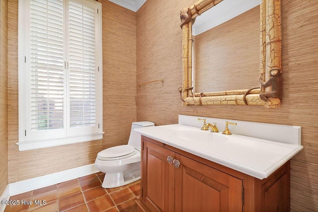 bathroom with tile patterned flooring, vanity, and toilet