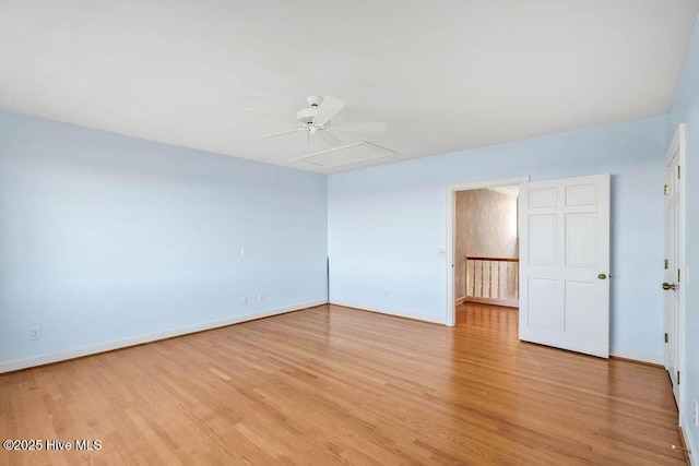 empty room with light hardwood / wood-style floors and ceiling fan