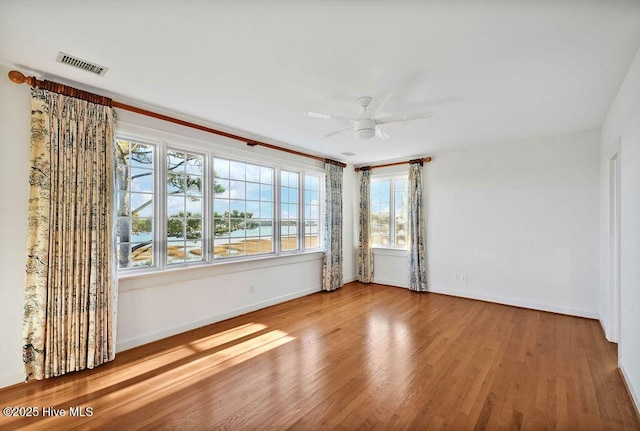 unfurnished room with ceiling fan and wood-type flooring