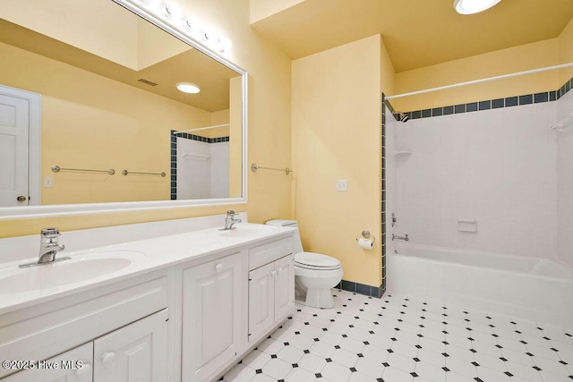 full bathroom with vanity, toilet, and tiled shower / bath