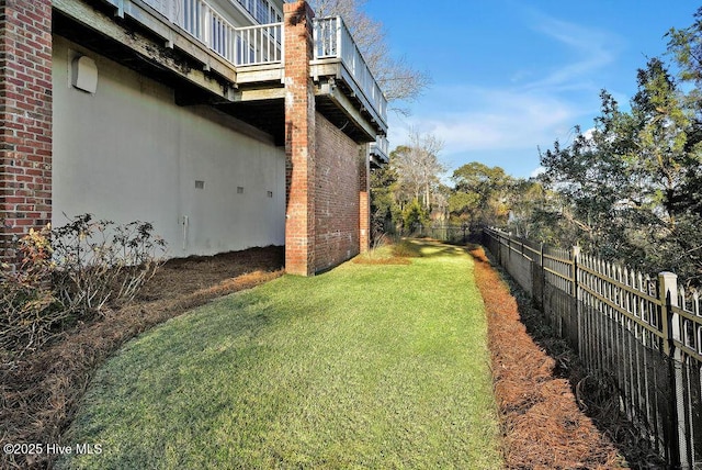 view of yard featuring a balcony