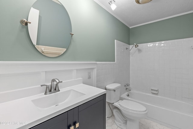 full bathroom with tile patterned flooring, crown molding, a textured ceiling, toilet, and tiled shower / bath