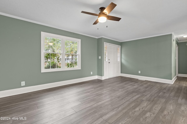 unfurnished living room featuring ceiling fan, hardwood / wood-style floors, and crown molding