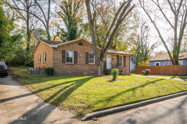 ranch-style house featuring a front lawn