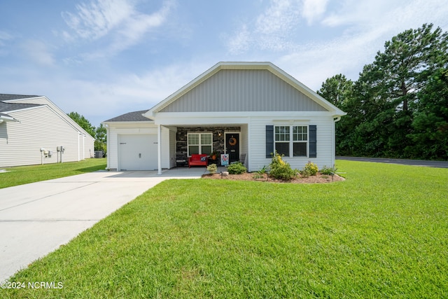 view of front of house with a garage and a front lawn