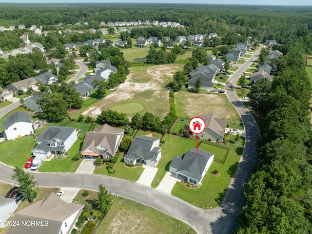 aerial view with a residential view and a view of trees