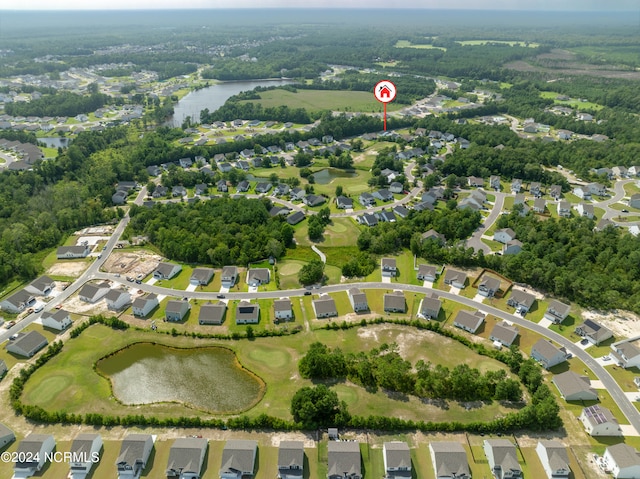 birds eye view of property with a water view and a residential view