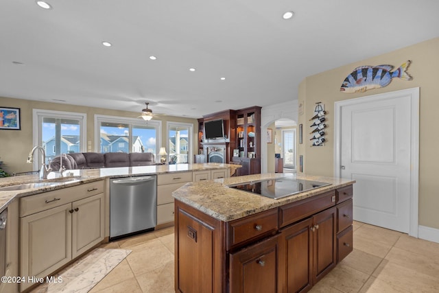 kitchen with dishwasher, black electric stovetop, sink, ceiling fan, and light stone countertops